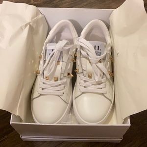 White sneakers with studs, designer inspired